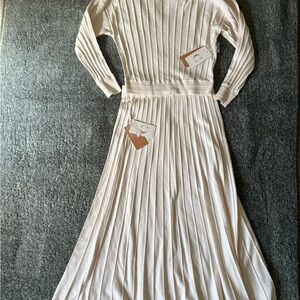 Elegant Cream Long-Sleeve knit top and skirt.